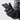 A hand modeling a glove, holding a phone to show the glove's touchscreen compatible fingertips.