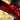 Close-up of a red scooter deck and clamp