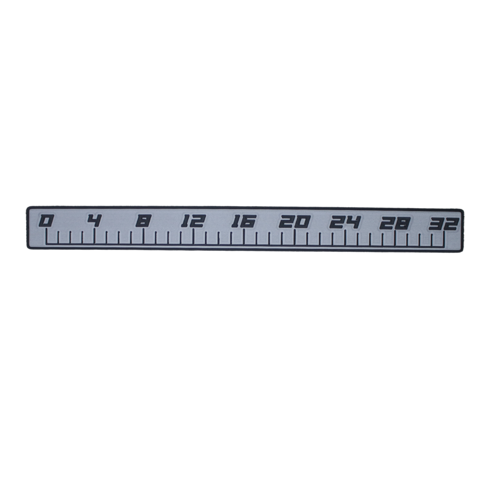 A grey and black foam ruler decal measuring from 0 to 32 inches. 