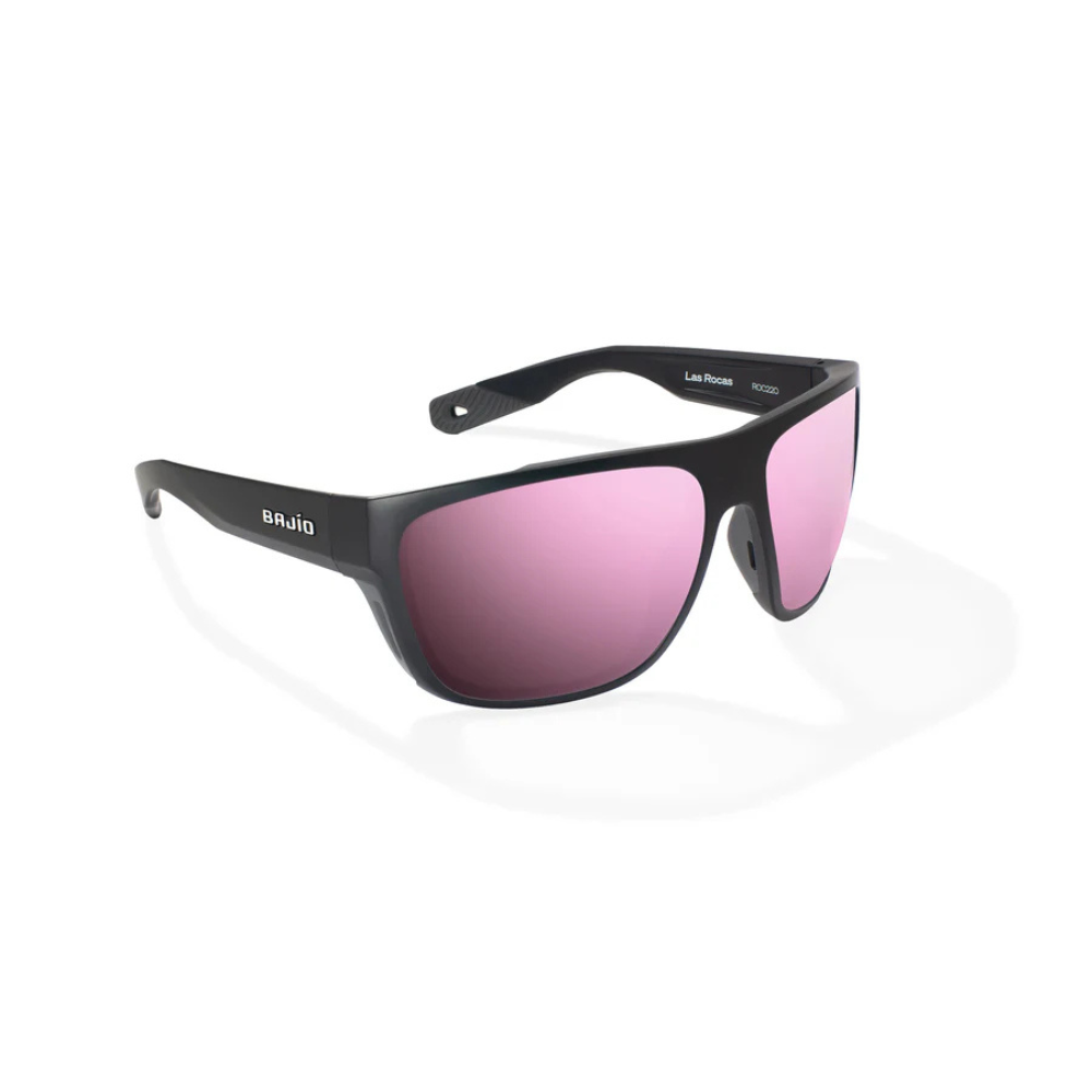 Black sunglasses with pink gradient lenses on a white background.