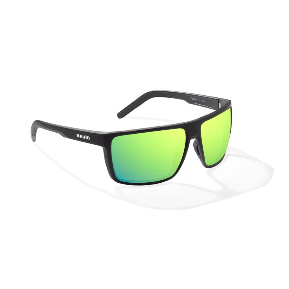 Sunglasses with green gradient lenses and a thin black frame.