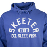 Close up of a blue hoodie with white text 'Skeeter, 1948, Eat. Sleep. Fish.' on the chest.
