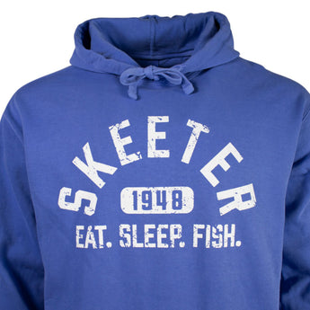 Close up of a blue hoodie with white text 'Skeeter, 1948, Eat. Sleep. Fish.' on the chest.