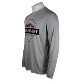 Side of a gray performance long-sleeve shirt with a logo on the front. 