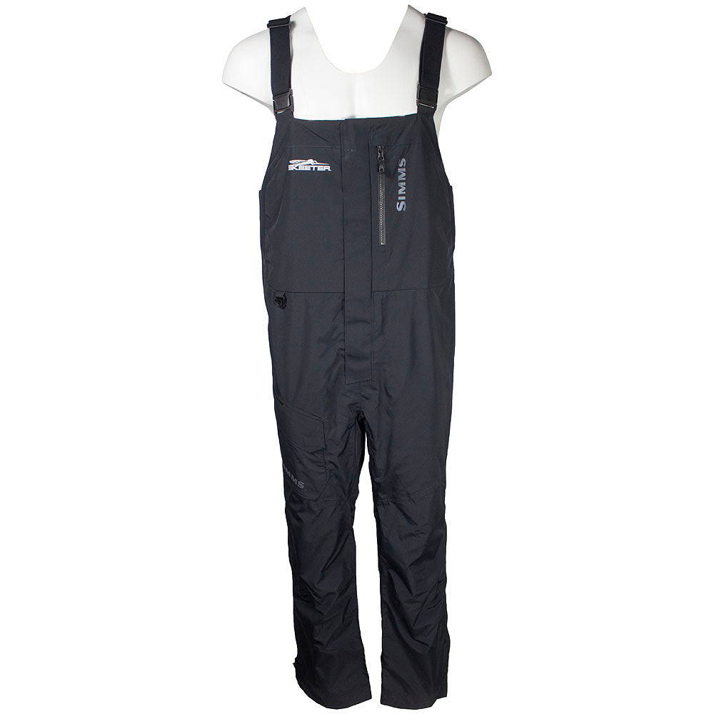 Front of black insulated bibs with adjustable straps, a zippered pocket on the left chest, Simms logos on the chest and thigh, and the Skeeter logo in white on the right chest. 