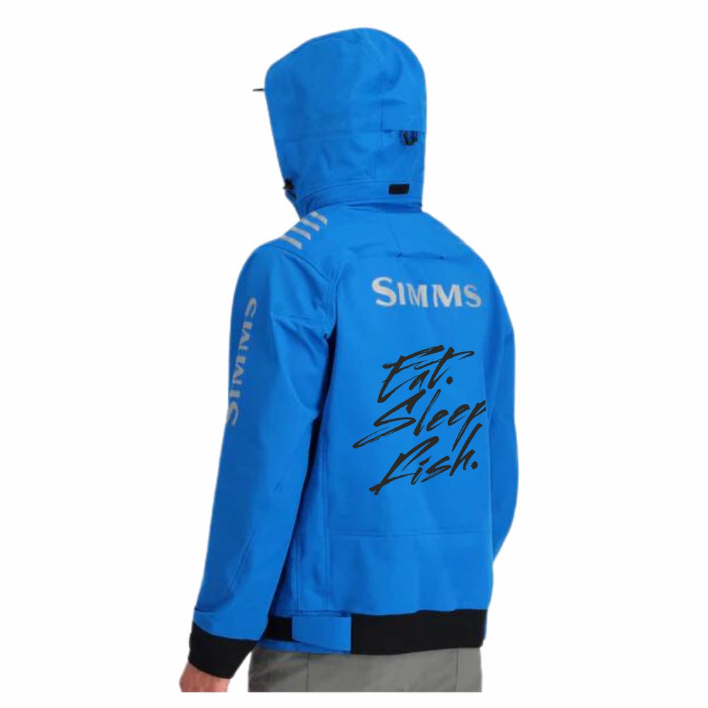 A man modeling the back left side of a blue fishing jacket, featuring the Simms logo in grey across the shoulder blades and the text "Eat. Sleep. Fish." in black across the back. Down the left forearm is the Simms logo in grey. 