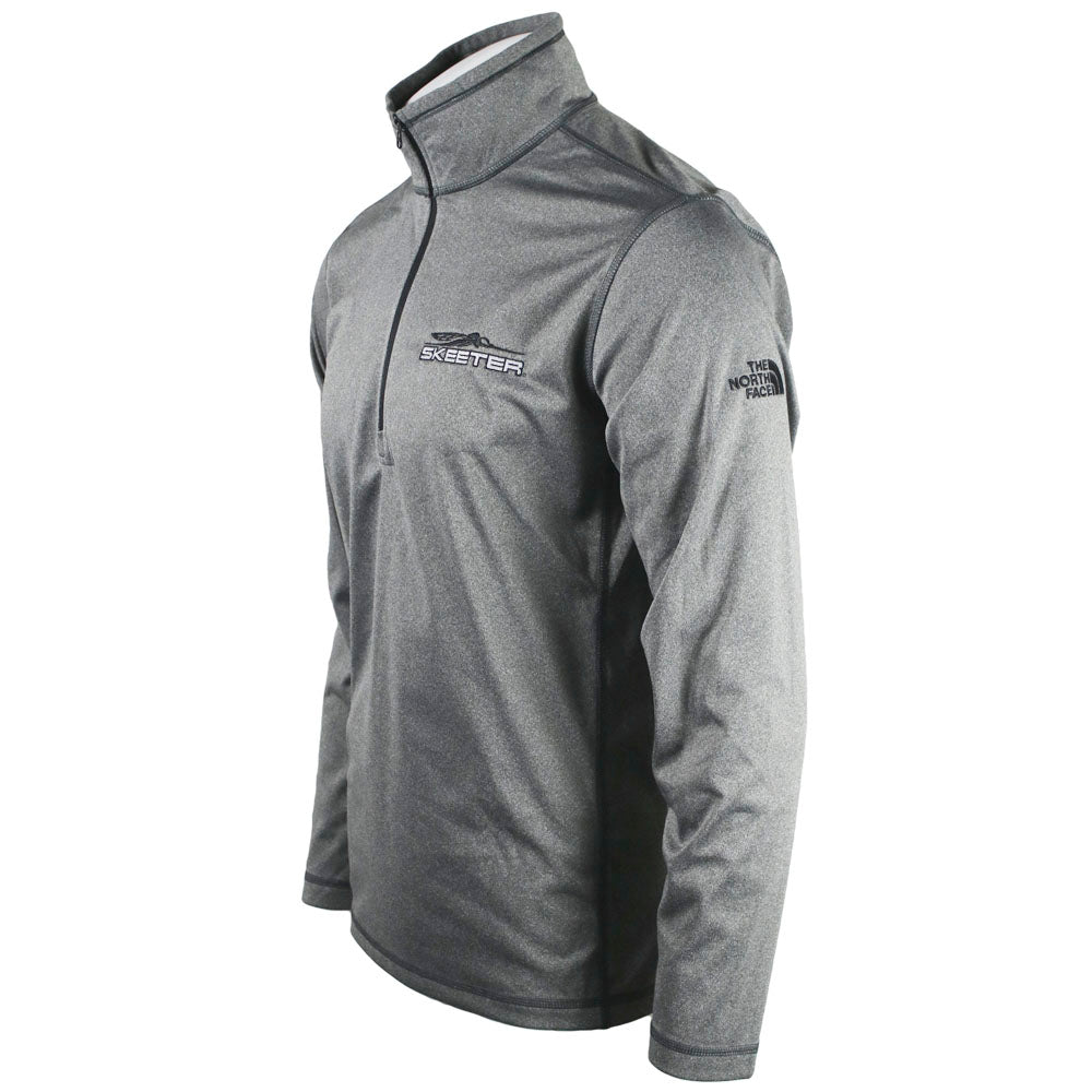 The left side of a grey quarter zip with a black zipper, showing The North Face logo in black on the shoulder. 