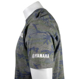 Close up of the left sleeve of a green camo tee with the Yamaha logo printed in white above the cuff. 