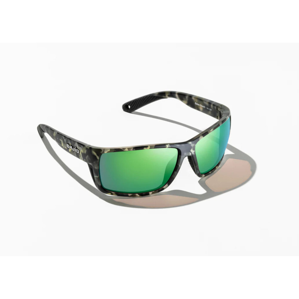 Sunglasses with grey tortoiseshell frames and blue/green reflective lenses.